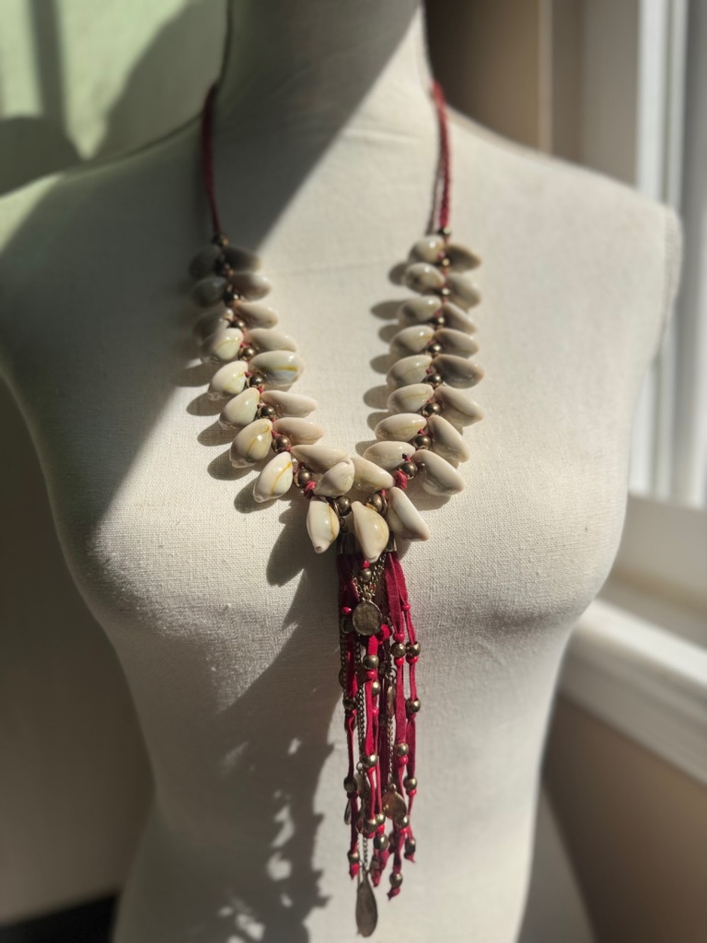 Handcrafted Cream Shell Statement Necklace with Burgundy Tassel